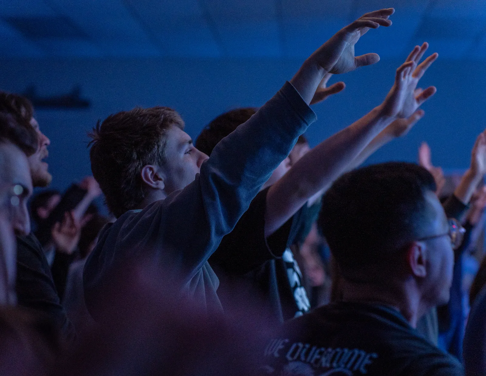 Hands raised in worship at Sun City Church