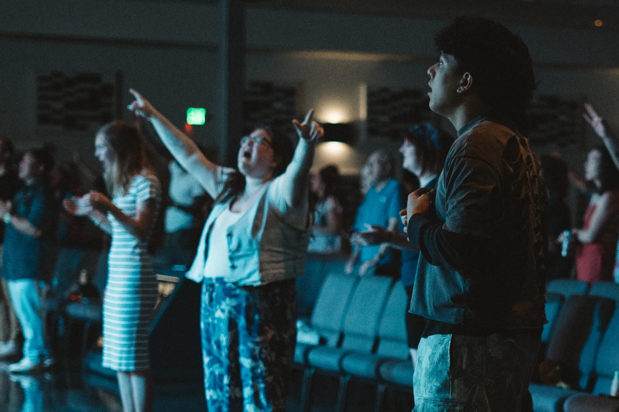 The Sun City Church congregation praying together