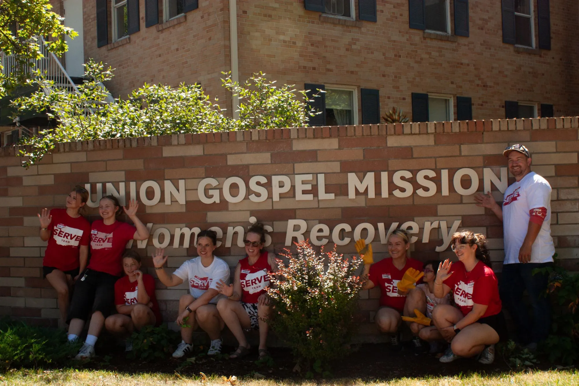 A Serve Day team in red SERVE shirts at Union Gospel Mission Women's Recovery