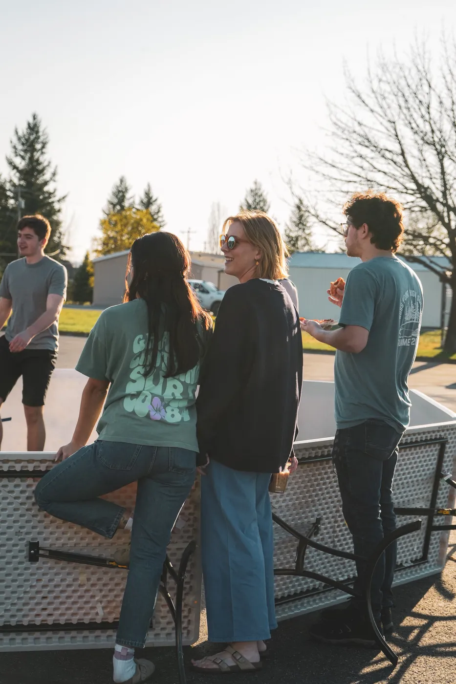 Students hanging out together outside at a YAYA night